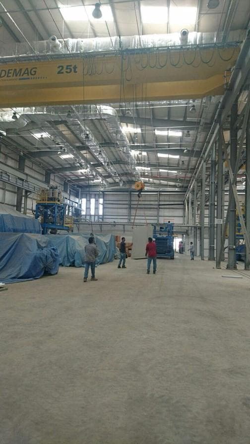 Interior of an industrial warehouse with overhead crane equipment