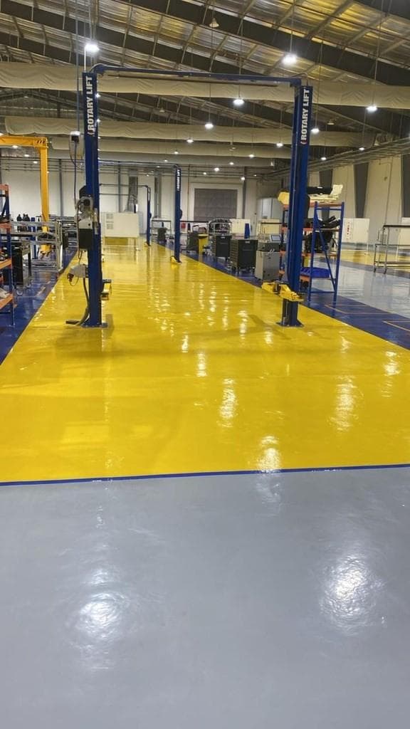 Industrial workshop floor with epoxy coating and equipment